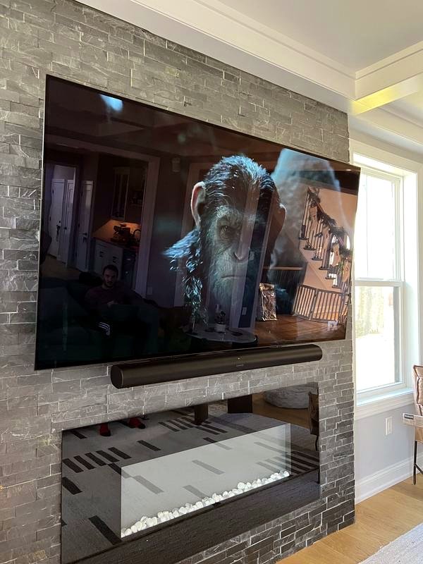 TV with soundbar on stacked stone
